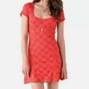 Coral Free People cap sleeve lace mini dress.